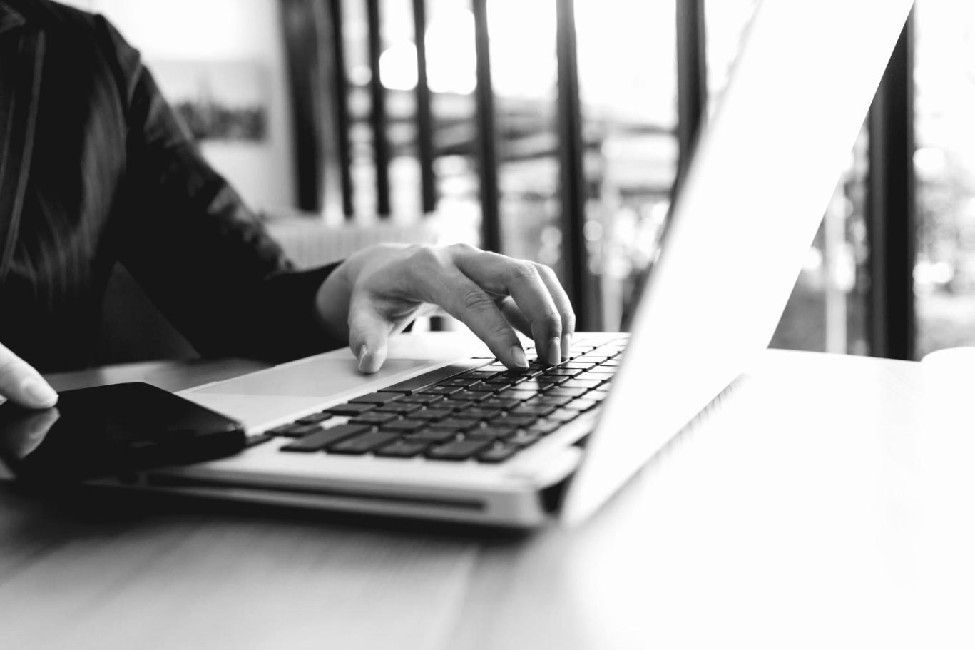 Student working on professional color grading project in modern editing suite