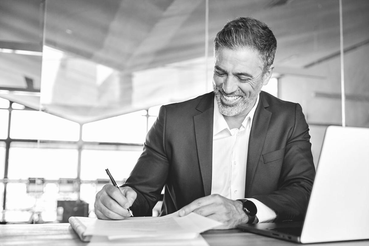 Professional color grading workspace with multiple monitors displaying video footage